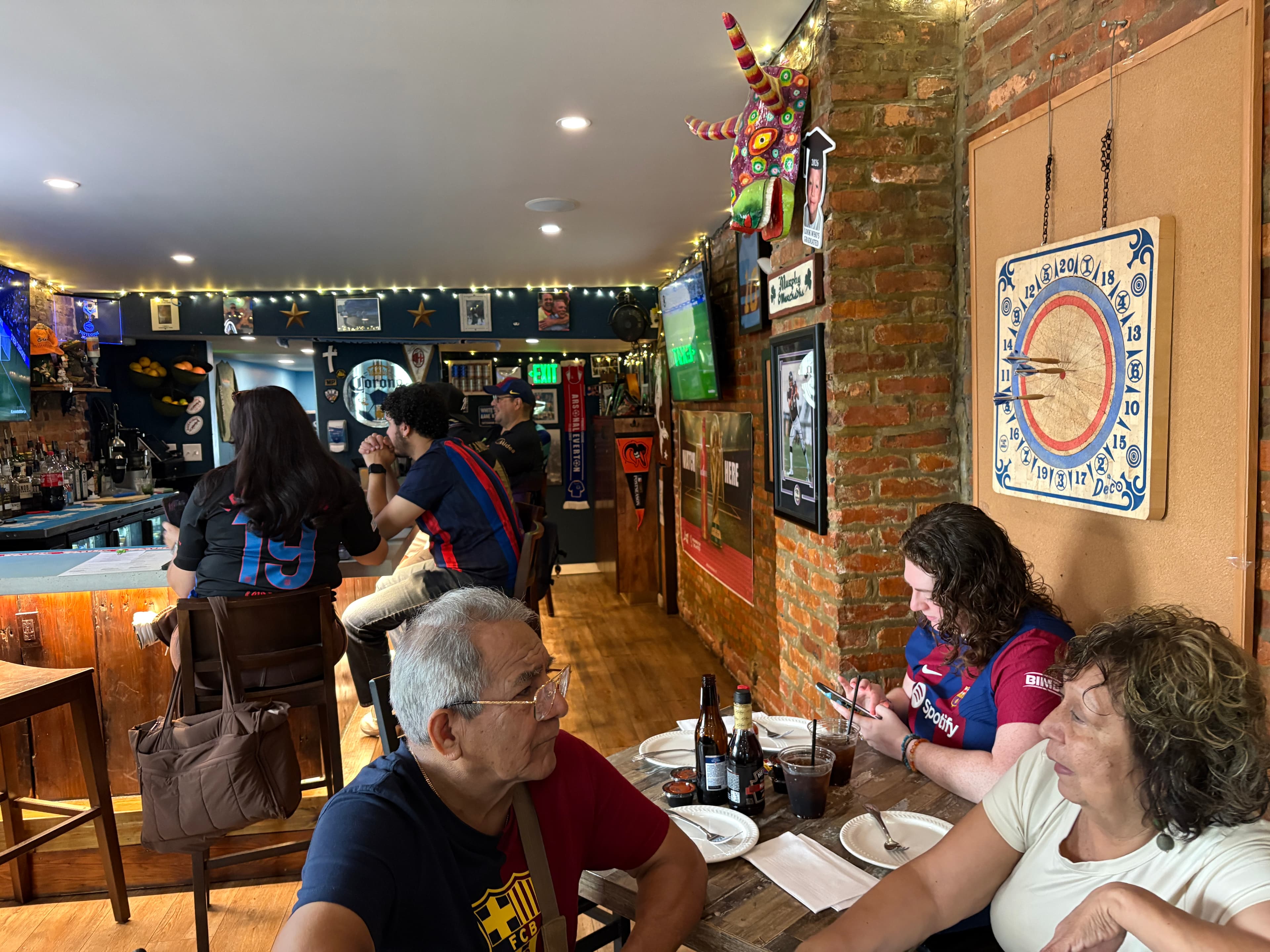 Charm City Culés members dining and watching a match at Barracudas